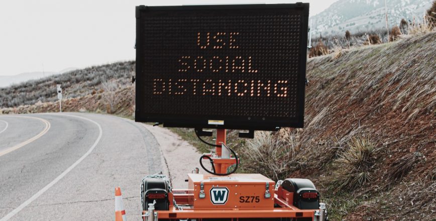 Social distancing digital road sign